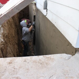 Apply a water repellent plaster to the block wall 